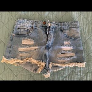Cute distressed jean shorts with lace trim